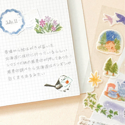 Notebook with hand-drawn stickers.