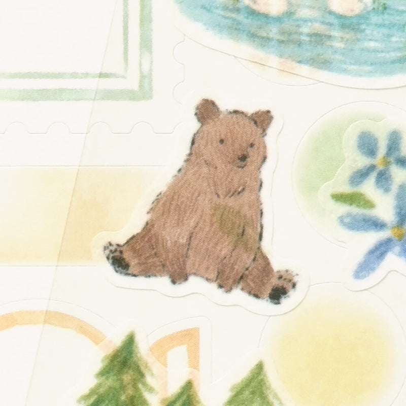 Sticker of a bear surrounded by nature-themed elements on a white background