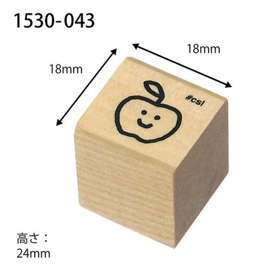 Wooden stamp with an apple design and measurements on a white background