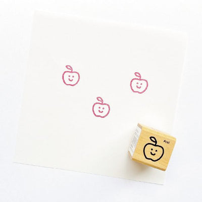 Rubber stamp with apple design on a white background