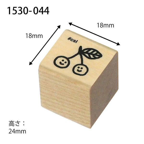 Wooden stamp block with cherry design and measurements on a white background