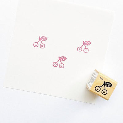 Cherry stamp with a matching stamp on a white background