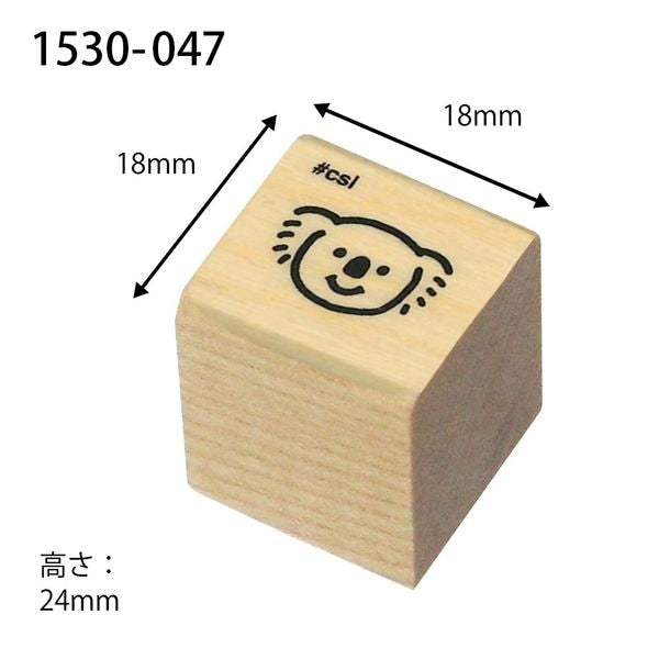 Wooden stamp block with a smiley face design and dimensions labeled on a white background.