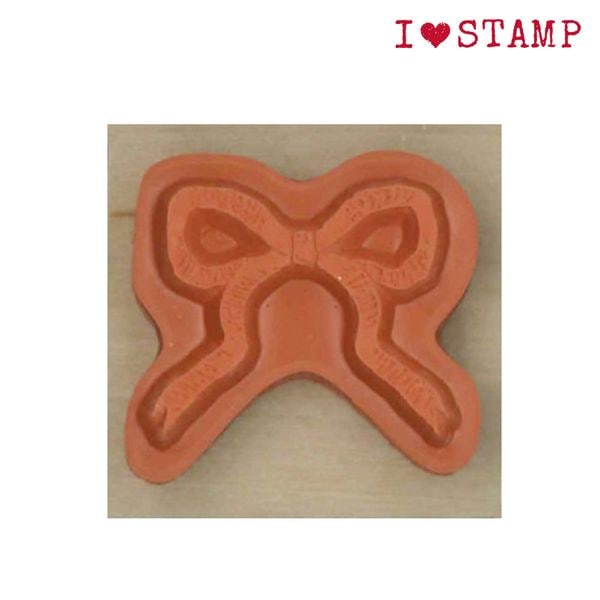 Bow-shaped stamp on a wooden background with &