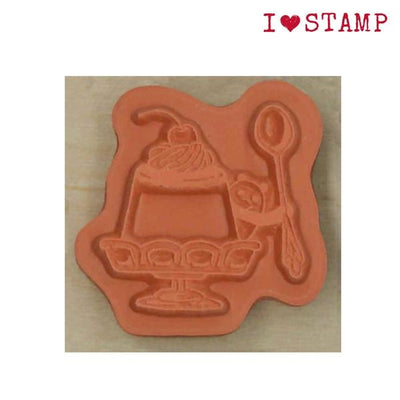 Decorative stamp with a design of a dessert and spoon on a beige background, featuring 'I ❤️ STAMP' text.