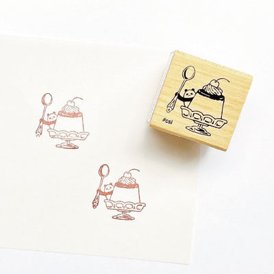 Rubber stamp with dessert design on a white background