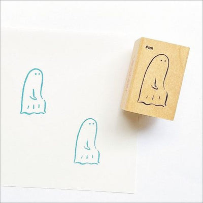Ghost-shaped rubber stamp with ink pad on a white background