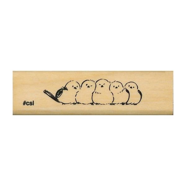 Wooden stamp with a design of five chicks and a worm on a white background