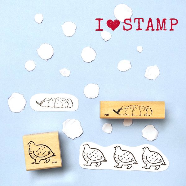 Bird-themed rubber stamps on a light blue background with &