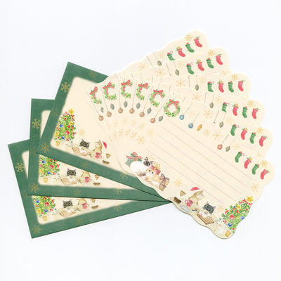 Set of Christmas-themed stationery items including envelopes and paper with festive designs.