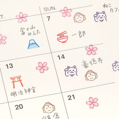 Calendar with hand-drawn symbols and text on each day