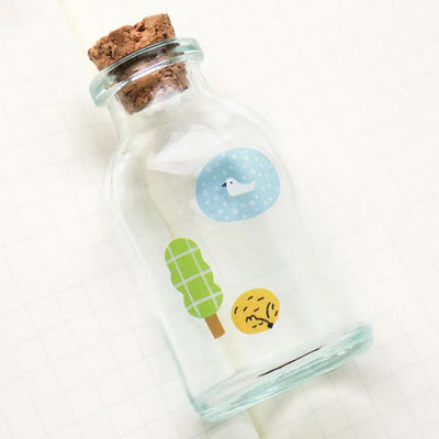 Glass bottle with cork lid featuring cartoon illustrations on a white background