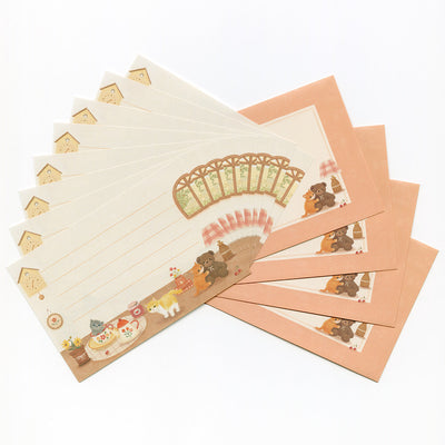 Set of stationery items with cute illustrations on a white background