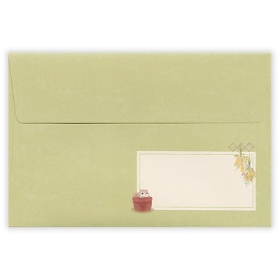 Green envelope with a small illustration of a cat and a plant on a white background