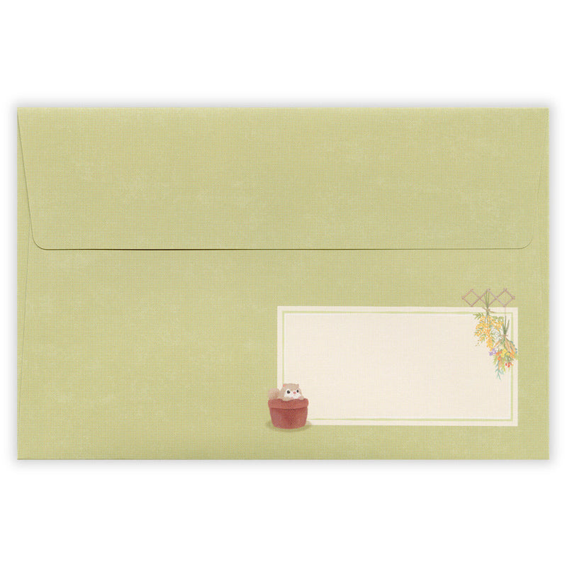 Green envelope with a small illustration of a cat and a plant on a white background