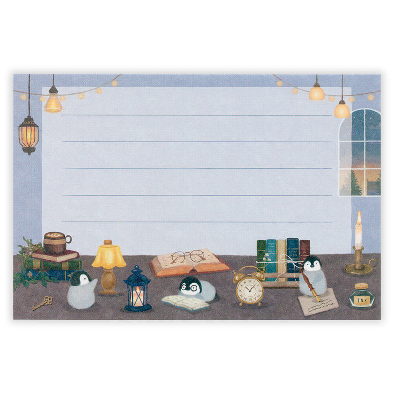 Illustration of a desk with various objects including books, a lamp, and penguins on a blue background.