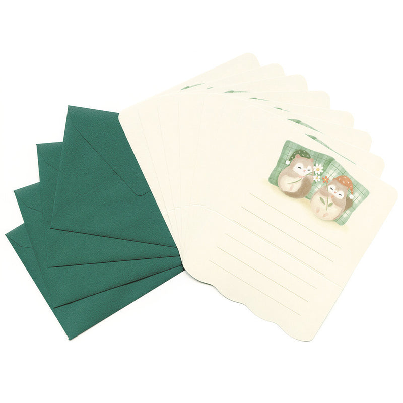 Set of green envelopes and a letter with cartoon characters on a white background
