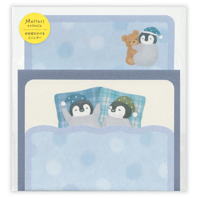 Stationery set with penguins and a bear in bed, featuring Mattari animals branding.