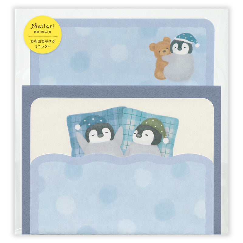 Stationery set with penguins and a bear in bed, featuring Mattari animals branding.