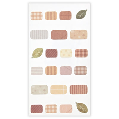 Patterned paper with various shapes and leaf designs on a white background