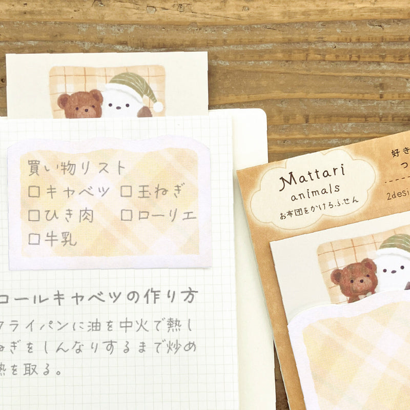 Set of stationery items with bear designs on a wooden surface