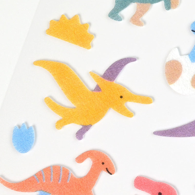 Colorful dinosaur-shaped stickers on a white background