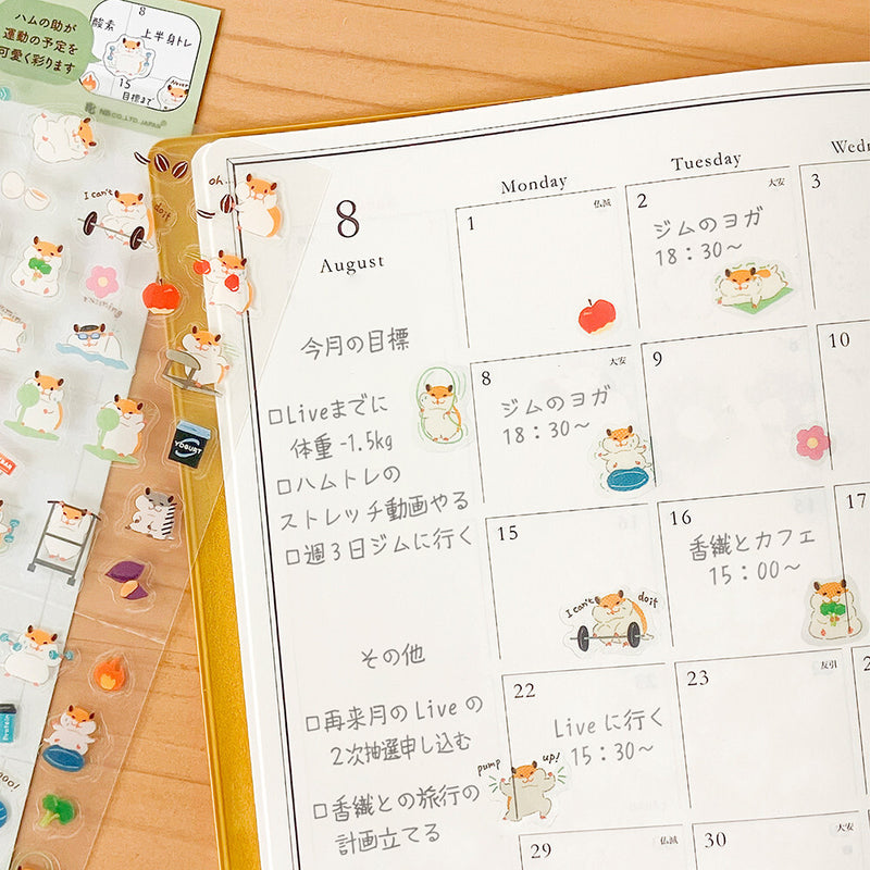 Calendar with cartoon hamster designs on a wooden surface