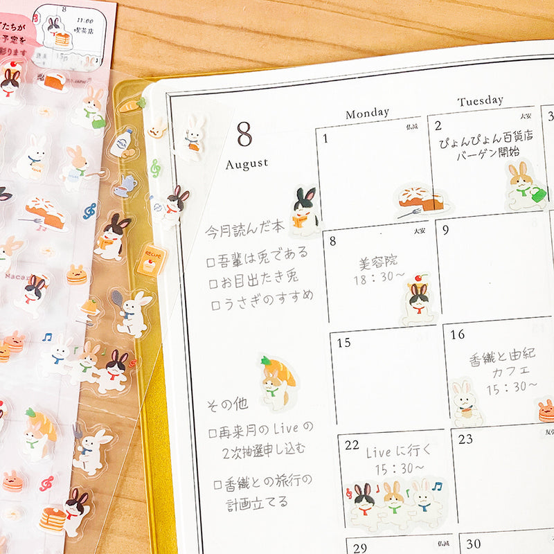 Calendar with cartoon rabbit designs on a wooden surface