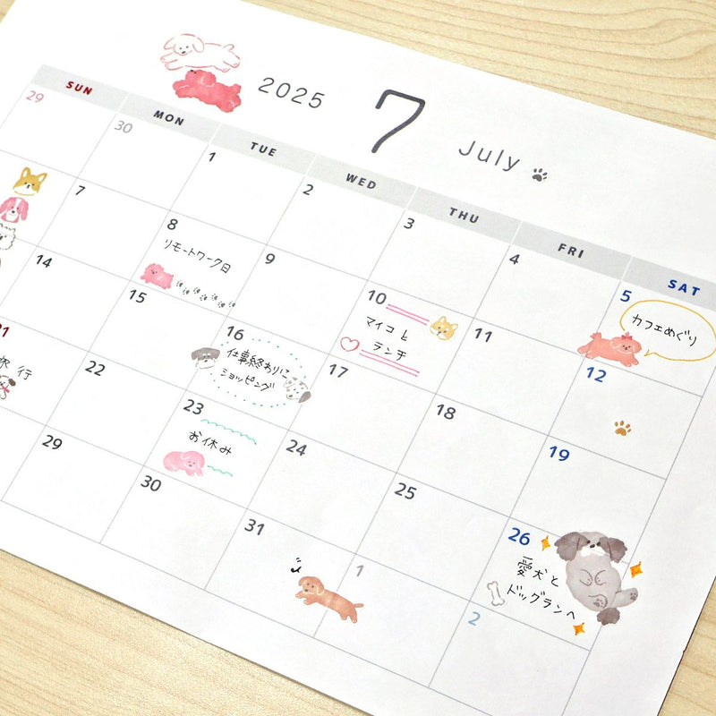 Calendar for July 2025 with cute illustrations on a wooden surface