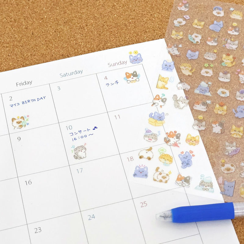 Calendar with cute animal stickers on a cork board