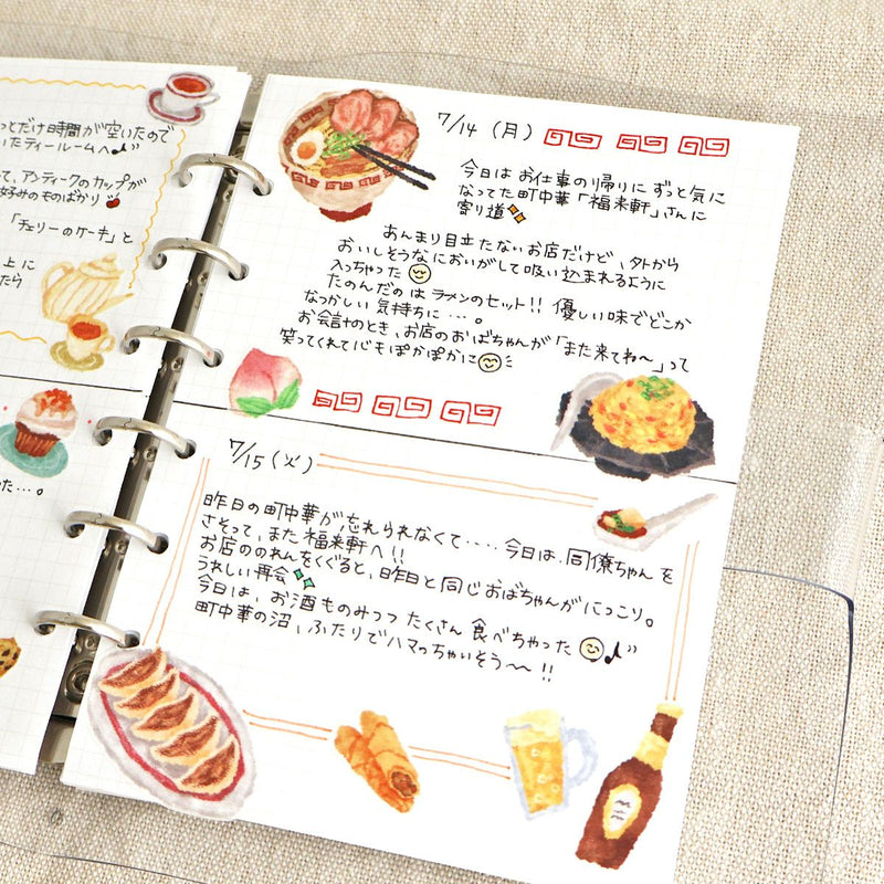 Notebook with food illustrations and text on a textured surface