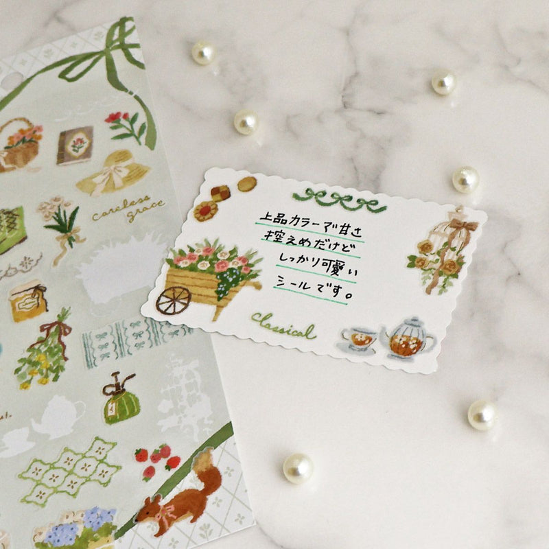 Decorative card with floral design and text on a textured surface with decorative elements.