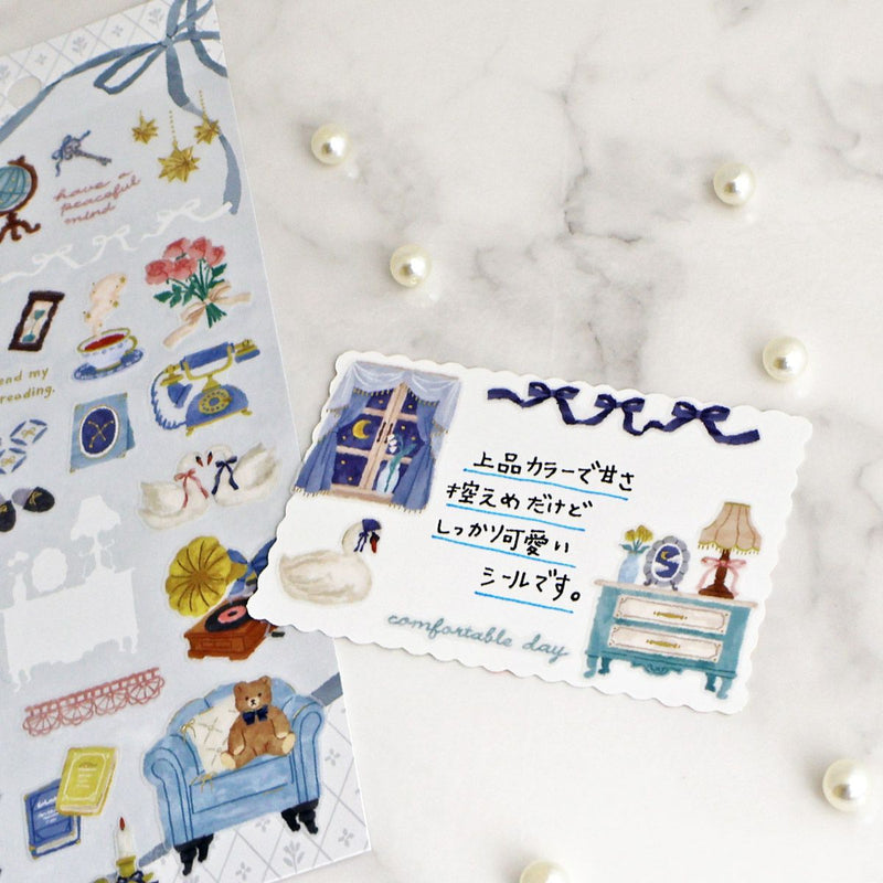 Decorative stickers with illustrations on a marble surface