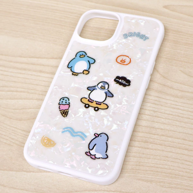 Phone case with penguin designs on a wooden surface