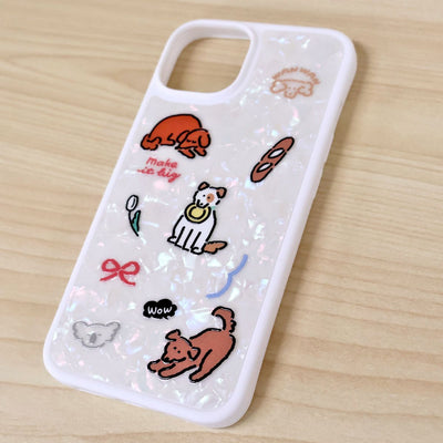 Phone case with cartoon designs on a wooden surface