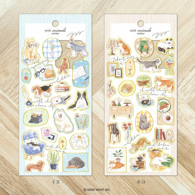 Two packages of animal-themed stickers on a wooden surface