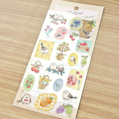 Sheet of decorative stickers with various illustrations on a wooden surface