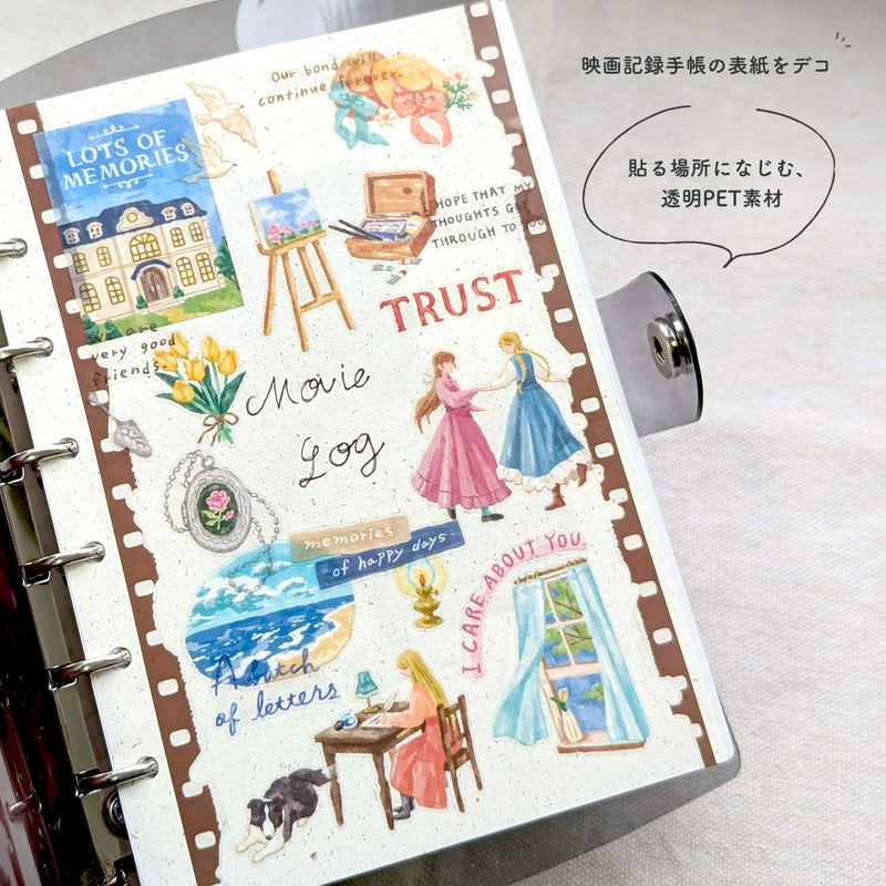 Decorative planner with illustrated stickers on a white surface