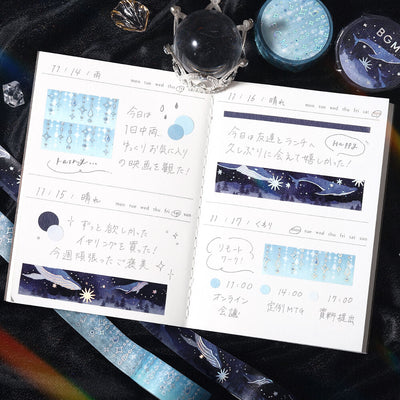 Open notebook with starry night design on a dark background