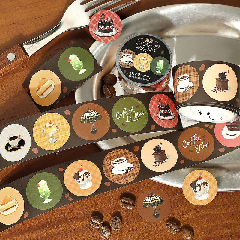 Set of miniature food containers with illustrations on a wooden surface with coffee beans.