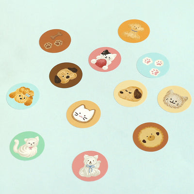Set of round stickers with cartoon animals on a light blue background
