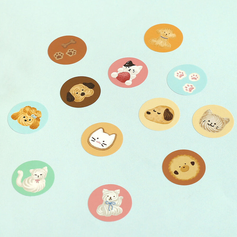 Set of round stickers with cartoon animals on a light blue background