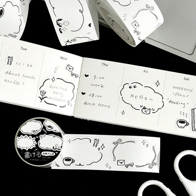 Black and white planner stickers with various designs on a black surface.