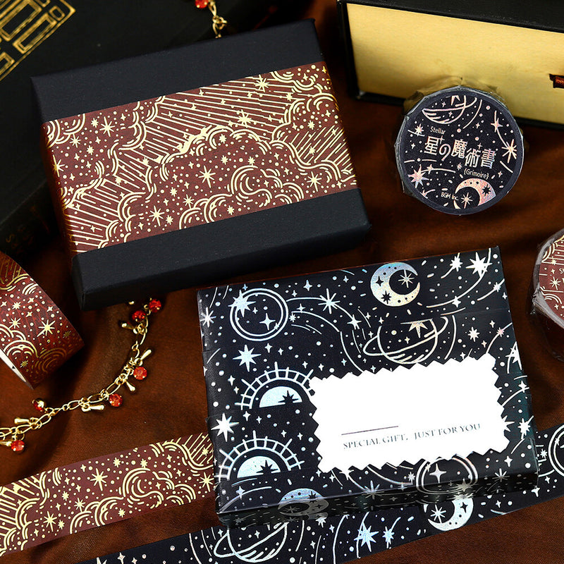 Decorative boxes with celestial designs on a wooden surface