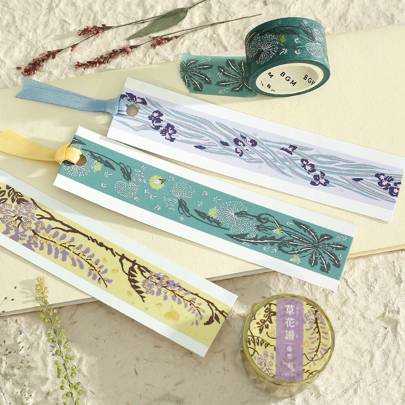 Decorative washi tape with floral designs on a textured surface