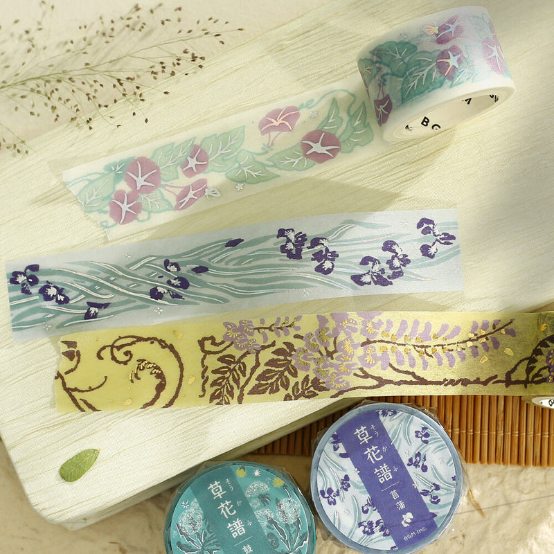 Set of decorative tapes with floral patterns on a wooden surface