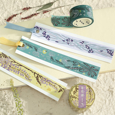 Decorative washi tape with floral designs on a textured surface
