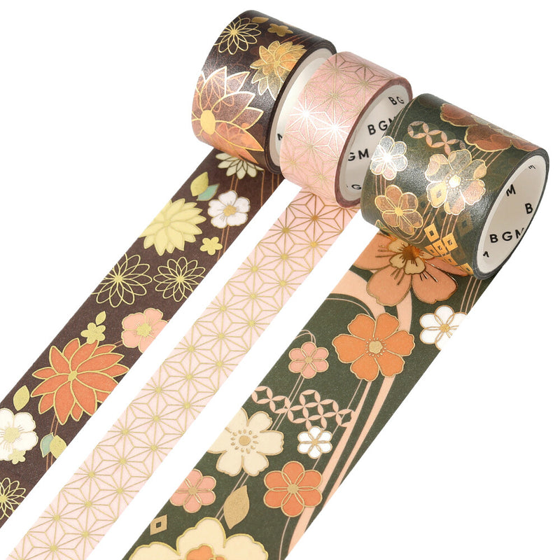 Three rolls of decorative tape with floral patterns on a white background