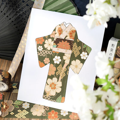 Card with a floral kimono design on a white background, surrounded by decorative elements.