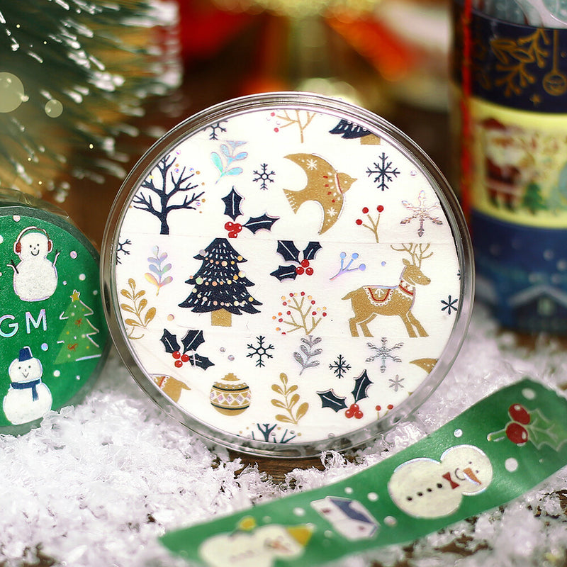 Decorative tape item with Christmas-themed design on a snowy surface